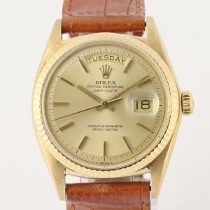 Vintage Rolex Day Date 18ct Yellow Gold Automatic Watch, Ref 1803, 36mm 18ct yellow gold case with champagne dial, weekday and date indicators, screwdown crown and acrylic crystal, on a brown leather strap with yellow gold Rolex pin buckle, Circa 1970s