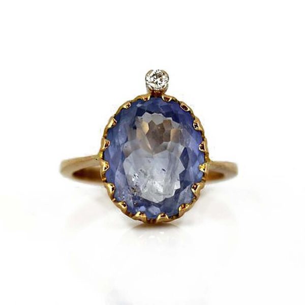 Vintage 3ct Sapphire and Diamond Cocktail Ring; featuring a 3 carat oval natural sapphire accented with a diamond top, in 18ct yellow gold, Circa 1970s