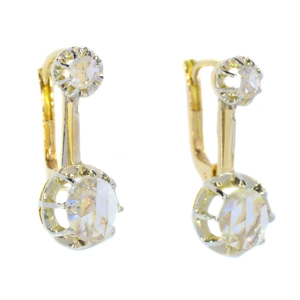 Vintage 1940s Rose Cut Diamond Drop Earrings; each earring features a large rose-cut diamond of 6½mm suspended from a smaller rose-cut diamond, in 18ct white and yellow gold