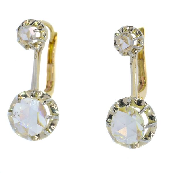 Vintage 1940s Rose Cut Diamond Drop Earrings; each earring features a large rose-cut diamond of 6½mm suspended from a smaller rose-cut diamond, in 18ct white and yellow gold