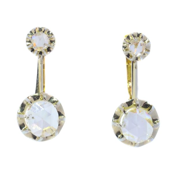 Vintage 1940s Rose Cut Diamond Drop Earrings; each earring features a large rose-cut diamond of 6½mm suspended from a smaller rose-cut diamond, in 18ct white and yellow gold