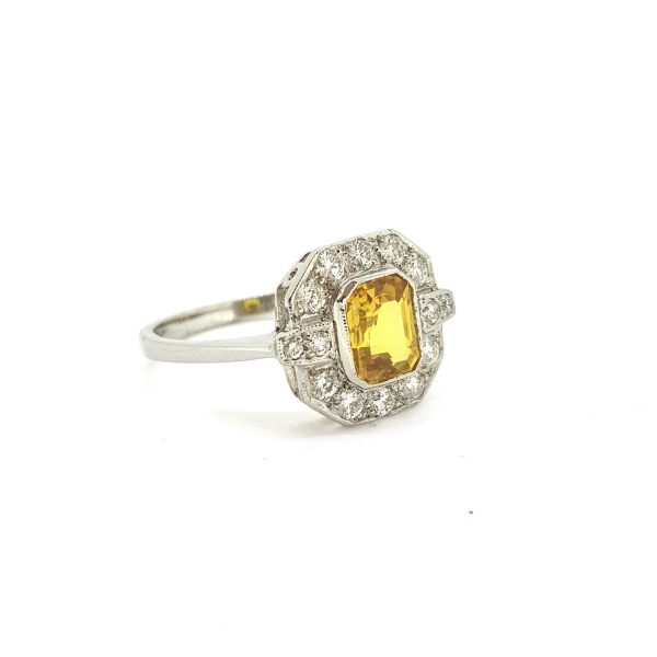 Yellow Sapphire and Diamond Cluster Dress Ring in Platinum; 1.50ct octagonal step-cut yellow sapphire surrounded by 0.55cts diamonds