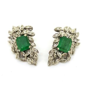 Vintage Emerald and Diamond Cluster Clip On Earrings; central emerald-cut emerald within a diamond leaf spray design surround in 18ct white gold
