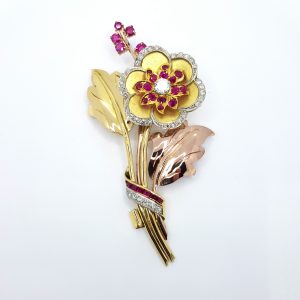 Vintage Ruby and Diamond Flower Spray Brooch; floral brooch dating from the 1940's set with rubies and diamonds, high carat yellow, rose and white gold