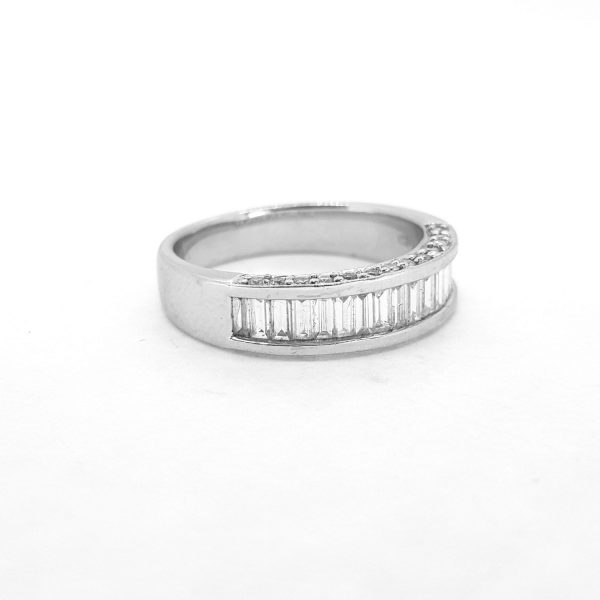 Baguette Cut Diamond Half Eternity Ring, 0.84 carat total, channel-set with baguette-cut diamonds with brilliant-cut diamond accents to the sides, in 18ct white gold