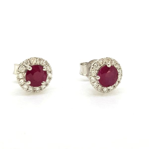Ruby and Diamond Cluster Stud Earrings; featuring 0.96cts circular rubies with 0.25cts diamond surrounds, in 18ct white gold