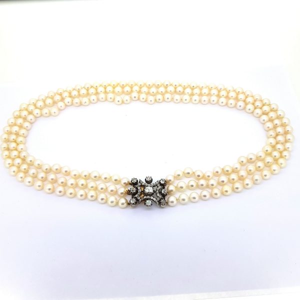Akoya Pearl Three Row Necklace with 4ct Old Cut Diamond Clasp; three row pearl necklace strung with Akoya pearls fastened with an old-cut diamond set clasp