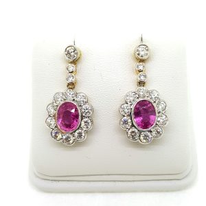 Pink Sapphire and Diamond Cluster Drop Earrings; featuring 2.70cts oval pink sapphires surrounded by 2.51cts diamonds, in 18ct gold