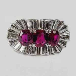 Vintage 1940s Ruby and Baguette Diamond Cocktail Ring; three rubies totalling 2 carats surrounded by 1.50cts baguette and tapering baguette diamonds in platinum