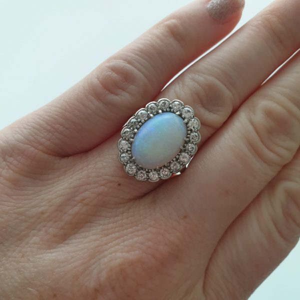 Antique opal ring on model finger