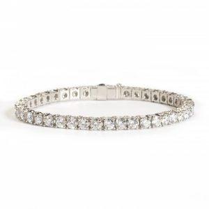Diamond Line Bracelet in Platinum, forty-one round brilliant-cut diamonds totalling 9.90 carats, each in individually hinged four-claw basket settings