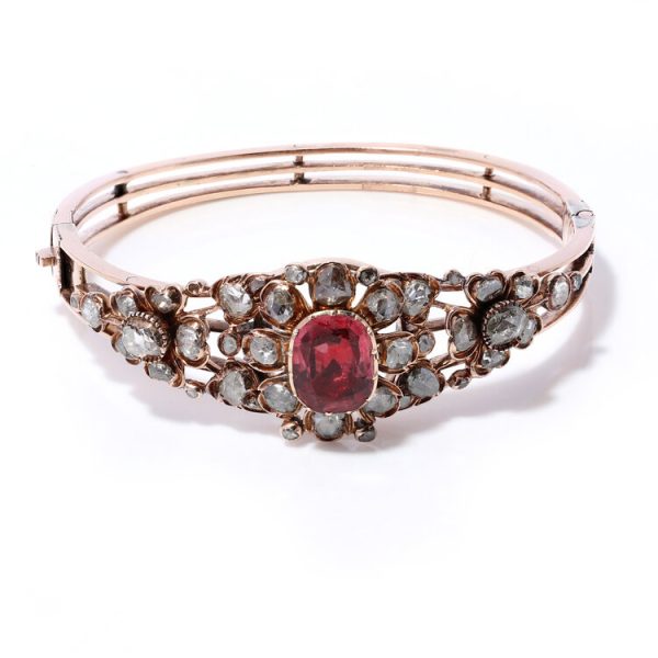 Antique Victorian 4ct Spinel and Diamond Cluster Bangle Bracelet; central 4ct oval spinel surrounded by 4.52cts rose-cut diamonds, in 15ct gold, Circa 1870s