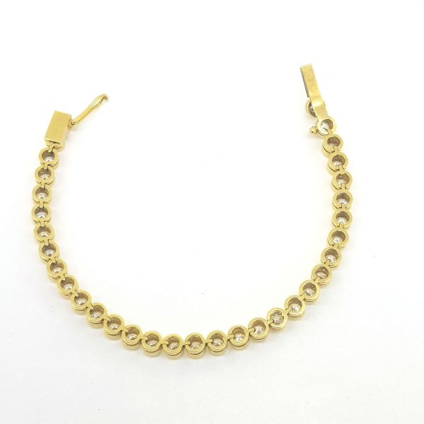 Collet Set Diamond Tennis Bracelet in 18ct Yellow Gold, 8.25 carat total, featuring 33 collet-set round brilliant-cut diamonds