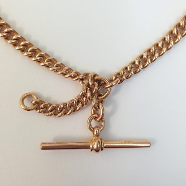 An Edwardian double graduated gold Albert chain necklace, this original pocket watch chain can have a dual purpose as a necklace. Each link has been stamped 9 and there is a Chester 9ct gold hallmark in the middle of one chain.