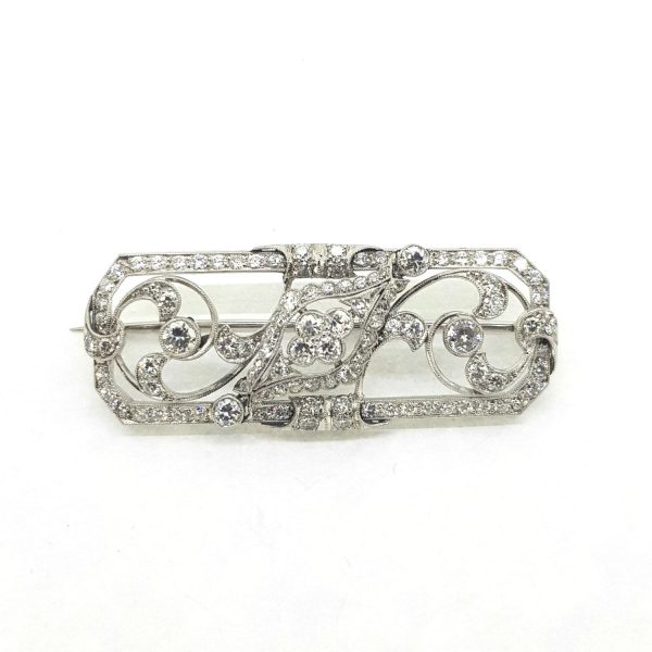 Vintage Diamond and Platinum Brooch; A beautiful openwork brooch crafted from platinum. The geometric floral design set with 2.20 carats of diamonds.