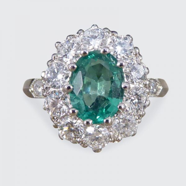 Contemporary 1ct Emerald and 0.95ct Diamond Cluster Ring