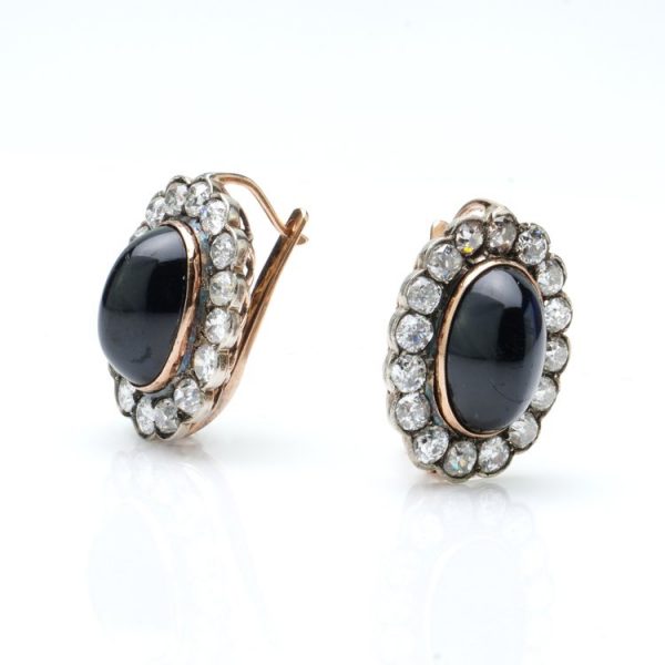 Antique Russian Cabochon Sapphire and Old Cut Diamond Cluster Earrings; 12cts cabochon blue sapphires surrounded by 6.40cts old-cut diamonds, in 14ct yellow gold with post and clip fittings, Circa 1850s