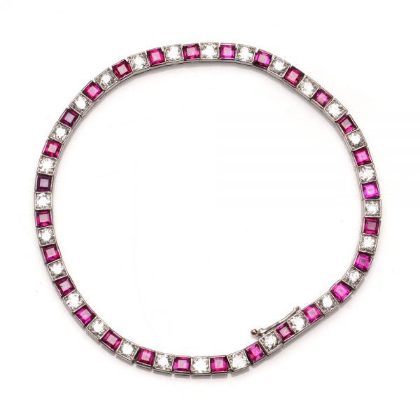Cartier Art Deco Ruby and Diamond Line Bracelet; with 3.50cts princess-cut rubies and 1.96cts old European-cut diamonds in platinum, Comes with GCS certificate and original Cartier box. Made in France, Paris, 1920s