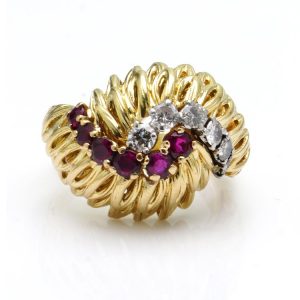 Vintage Boucheron 18ct Yellow Gold Ring with Rubies and Diamonds; abstract feather design gold mount set with 0.53cts diamonds and rubies. Made in France, Circa 1970s