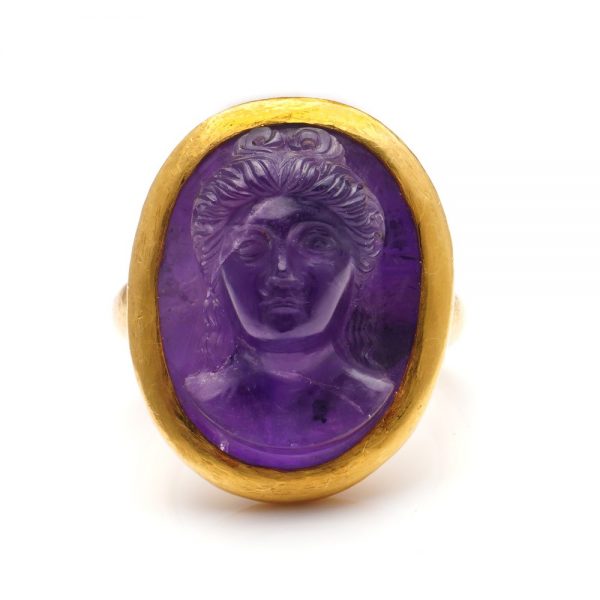 Antique Victorian Carved Amethyst Cameo Ring in 22ct Gold; high relief bust cameo of finely carved amethyst depicting the Mythical Goddess Fortune