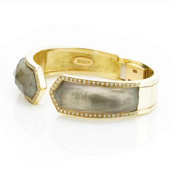 Stephen Webster Bangle Bracelet from Crystal Haze Collection; two faceted quartz crystal sections overlay a layer of Mother of Pearl, surrounded by 0.90cts brilliant cut diamonds, in 18ct yellow gold