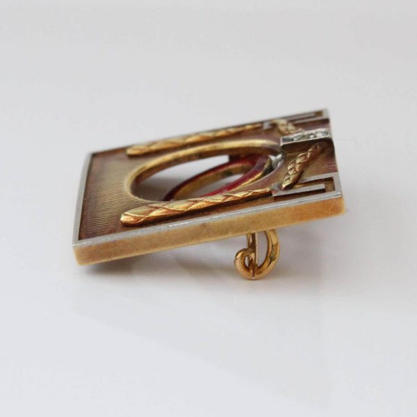 Antique Jugendstil Enamel and Gold Brooch by Theodor Fahrner; 18ct yellow gold frame with plaited swag in relief and central swinging natural pearl within red enamel oval surround. Circa 1900-1910