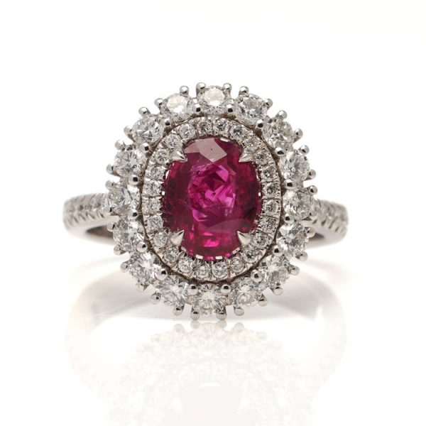 2.33ct Natural Burma Ruby and Diamond Cluster Ring; oval natural Burma ruby of 2.33 carats set within a double diamond surround totalling 1.20 carats, in 18ct white gold. Comes with certificate