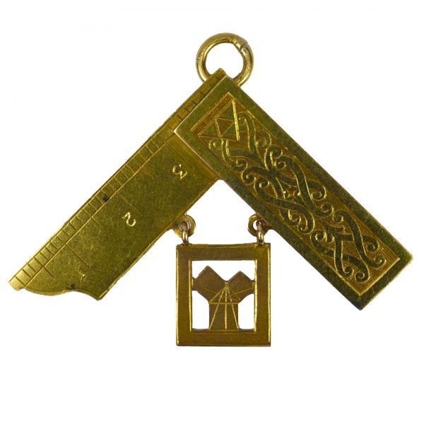 18ct Yellow Gold Masonic Charm Pendant; designed as a Masonic set square with inscription to reverse, Suspending a tag marked for 18ct gold, London. Ruler is hallmarked for Birmingham, 1949