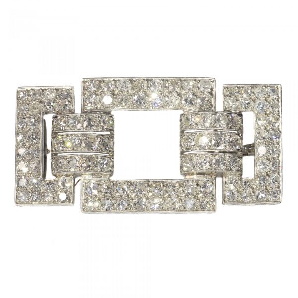 Art Deco Platinum and Diamond Brooch; bold geometric platinum brooch set with just over 4 carats of old mine-cut and single-cut diamonds. Circa 1920