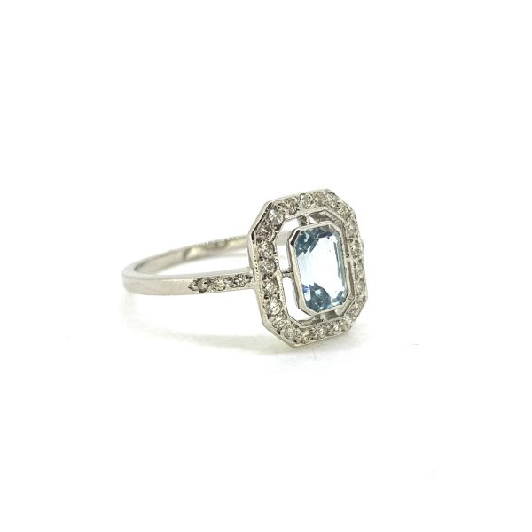 Aquamarine and Diamond Halo Ring in Platinum, central 1.80ct emerald-cut aquamarine within a fixed open diamond surround