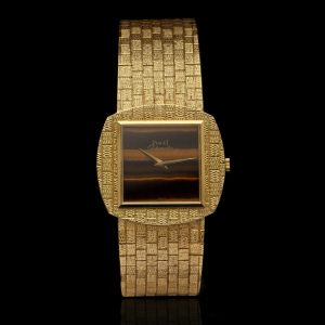 Vintage Piaget Tiger Eye and 18ct Yellow Gold Watch, tiger eye dial enveloped within 18ct yellow gold case, on 18ct yellow gold bracelet, with sapphire crystal and automatic movement, Circa 1970s