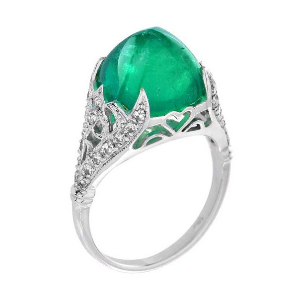 Sugarloaf Cabochon Colombian Emerald and Diamond Cocktail Ring; 7.58ct sugarloaf cabochon-cut Colombian emerald set high within a 0.33ct single-cut diamond-set openwork scrolled mount in 18ct white gold