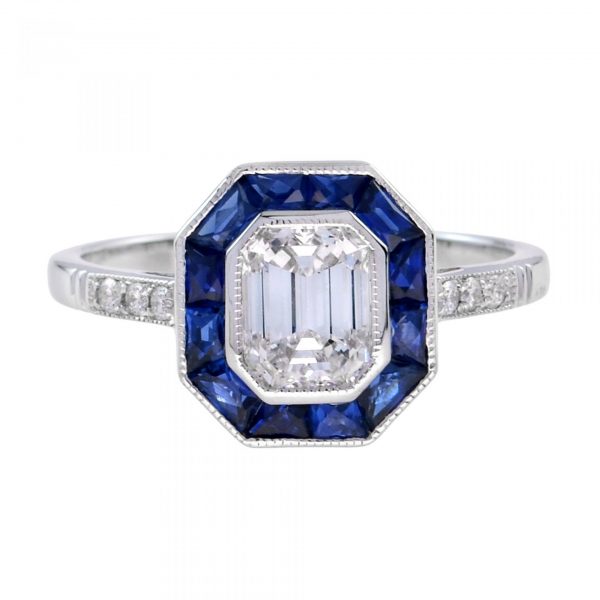 GIA Certified 0.92ct Emerald Cut Diamond and Calibre Sapphire Cluster Ring; D colour 0.92 carat emerald-cut diamond with calibre-cut sapphire border and diamond-set shoulders in 18ct white gold