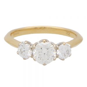 Three Stone Diamond Engagement Ring, 1.88 carat total; central 0.82ct round brilliant-cut diamond flanked by 0.49ct diamonds claw-set within an open gallery mounting in 18ct yellow gold