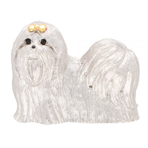 Gold Shih Tzu Dog Brooch with Sapphire Eyes; 18ct white gold standing Shih Tzu with hand carved fur detailing and polished yellow gold top knot bow, accented with two cabochon sapphire eyes and a black enamel nose