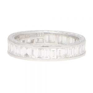 Art Deco Inspired 1.87ct Baguette Diamond Full Eternity Ring in Platinum; channel set with 36 baguette cut diamonds within 4mm band with hand carved spray detailing