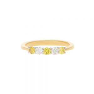 Natural Yellow and White Diamond Half Eternity Ring; three natural yellow diamonds and two white brilliant diamonds in an alternating pattern in 18ct yellow gold to a tapered band