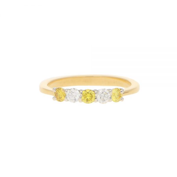 Natural Yellow and White Diamond Half Eternity Ring; three natural yellow diamonds and two white brilliant diamonds in an alternating pattern in 18ct yellow gold to a tapered band