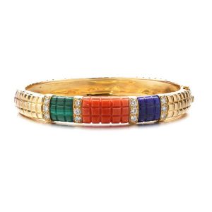 Van Cleef and Arpels Multi Gemstone and Diamond Bangle Bracelet; lapis lazuli, malachite, and coral panels accented with 1.20cts brilliant-cut diamonds. Made in France, Circa 1980s