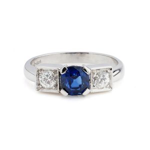 Cushion Cut Sapphire and Diamond Three Stone Ring in Platinum