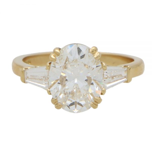 GIA Certified 3ct Oval Cut Diamond Three Stone Ring with tapered baguette shoulders