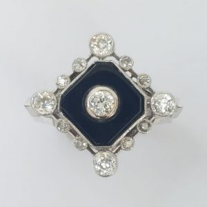 An Art Deco Onyx and Diamond Dress Ring