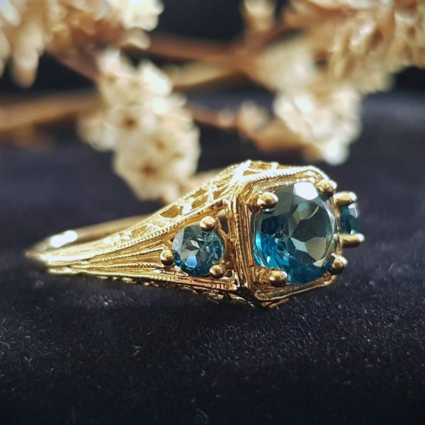 Blue Topaz Three Stone Filigree Yellow Gold Ring