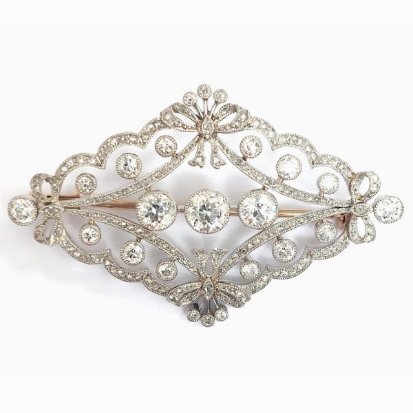 Antique Edwardian Old Cut Diamond Brooch, set with old European-cut diamonds within a rose cut diamond border designed as a quatrefoil of bows in platinum upon gold