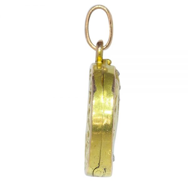 Art Nouveau gold locket with diamonds and gemstones.