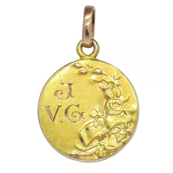 Art Nouveau gold locket with diamonds and gemstones.