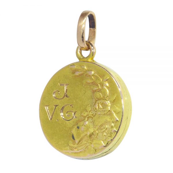 Art Nouveau gold locket with diamonds and gemstones.