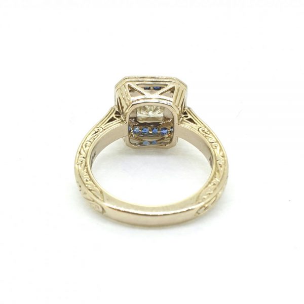 1.19ct Princess Cut Diamond and Calibre Sapphire Cluster Target Ring in 14ct yellow gold with hand carved detail around the shank