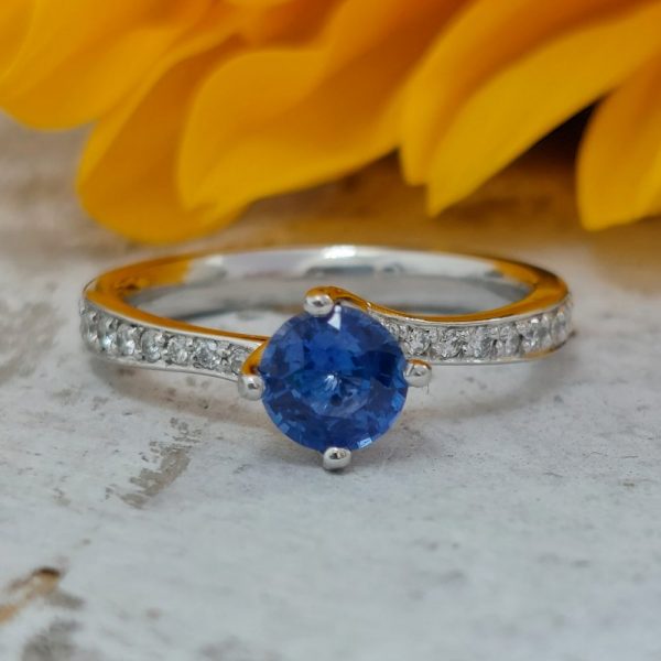 Modern 0.70ct Sapphire and Diamond Twist Setting Ring