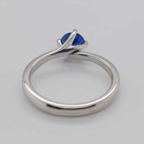 Modern 0.70ct Sapphire and Diamond Twist Setting Ring